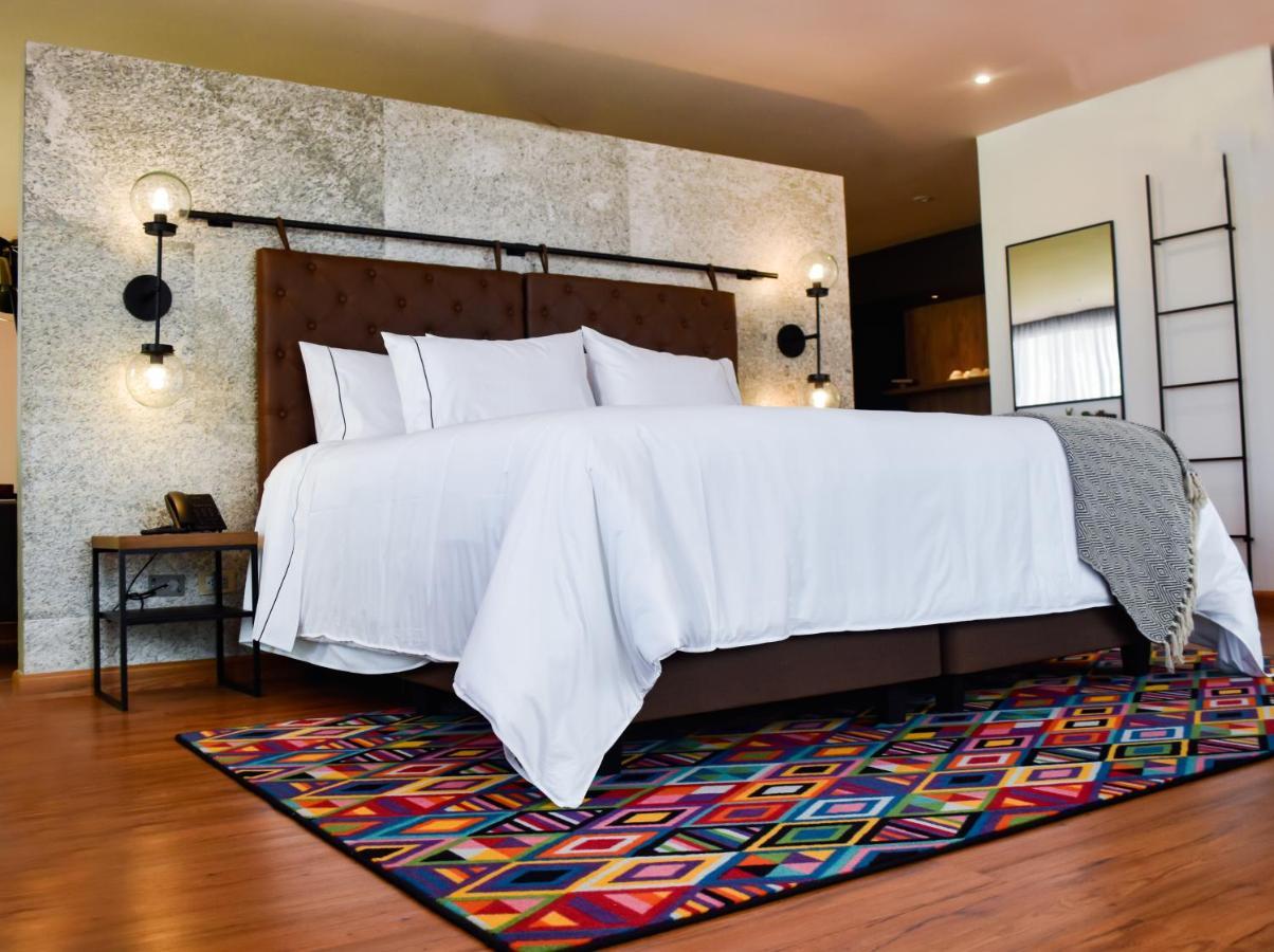 Hotel V1501 Пасто Екстериор снимка A bedroom with a carpet